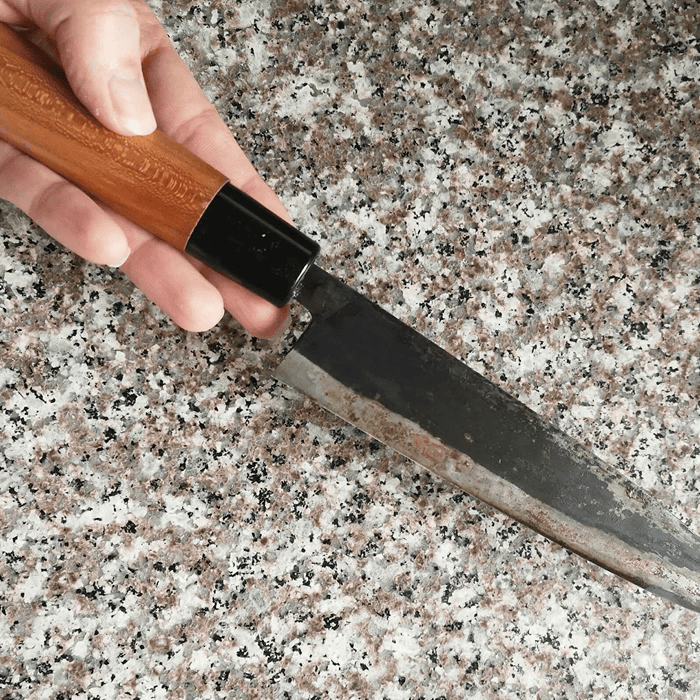 Knife used on a hard stone surface